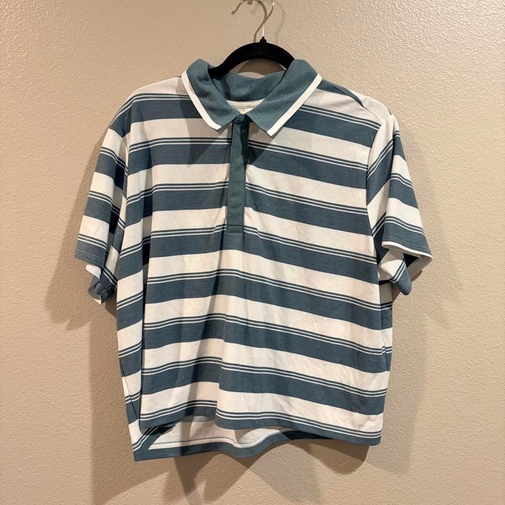 white and green horizontal striped polo shirt